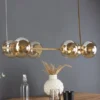 LED Pendelleuchte 6-flammig Messing & Amberglas Kugeln, Breite 80cm